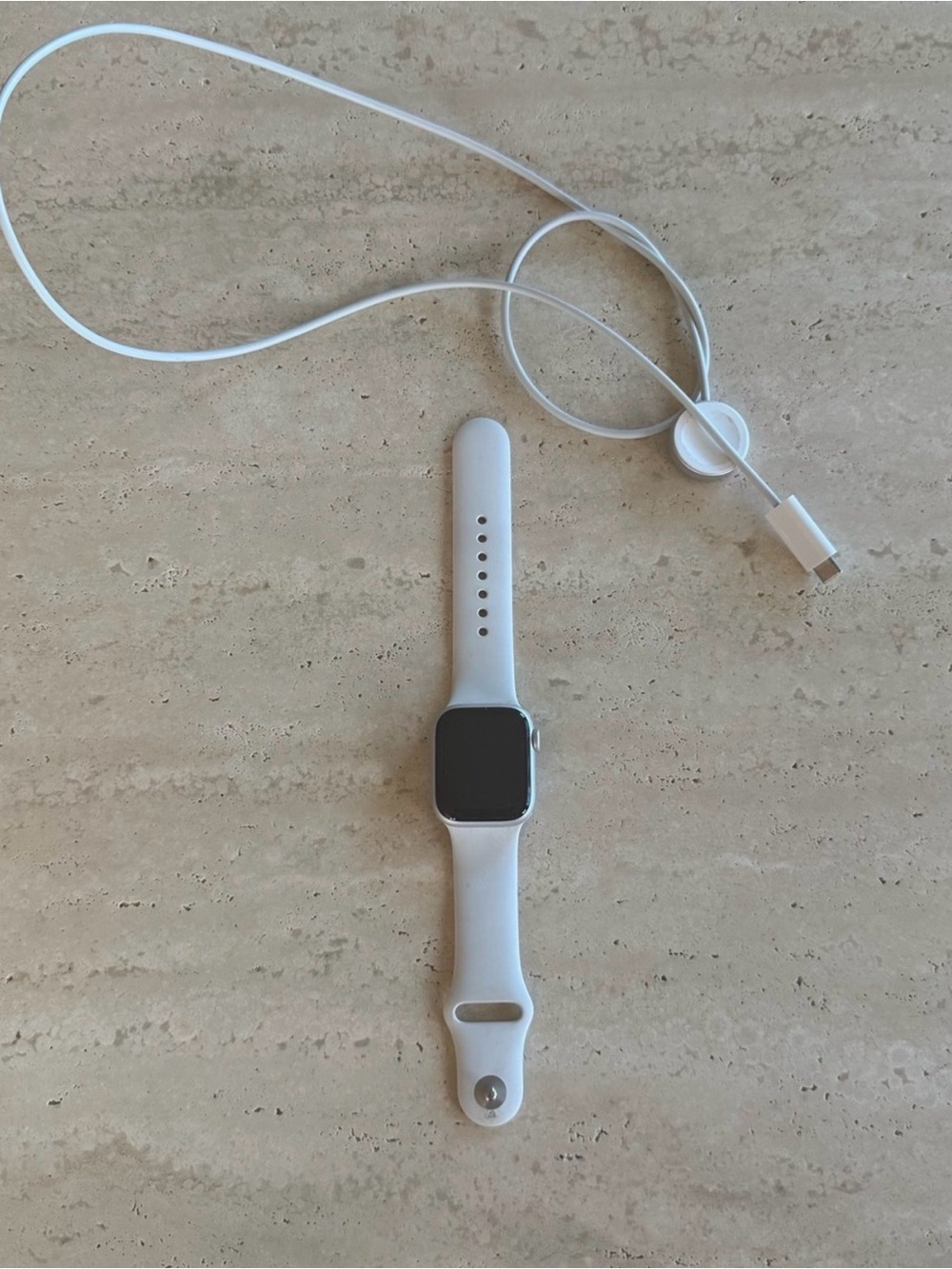 Apple Watch Series 8 with charging cord
